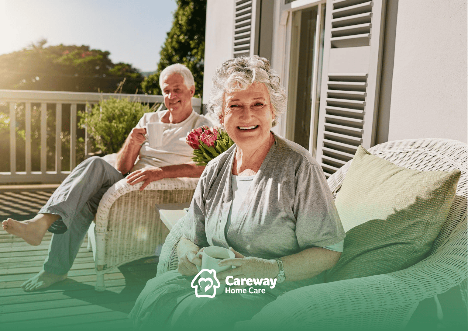An elderly couple in Pennsylvania sitting on their porch, smiling