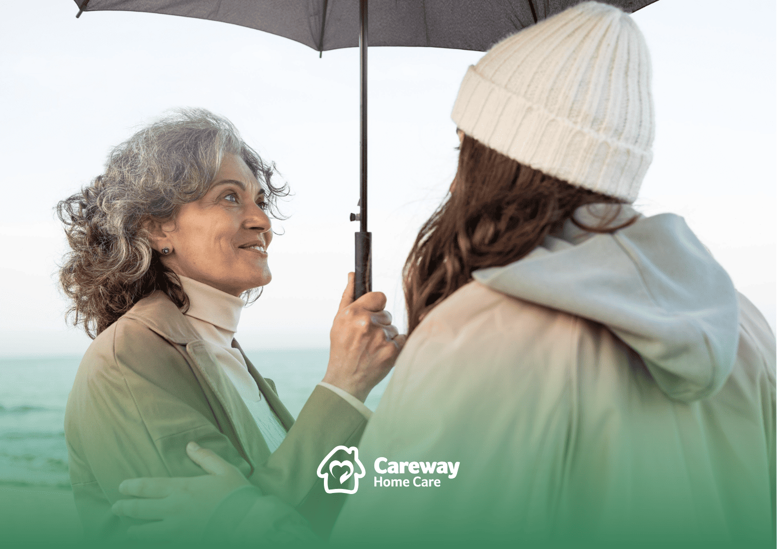 An elderly woman holding an umbrella with her caregiver in Pennsylvania